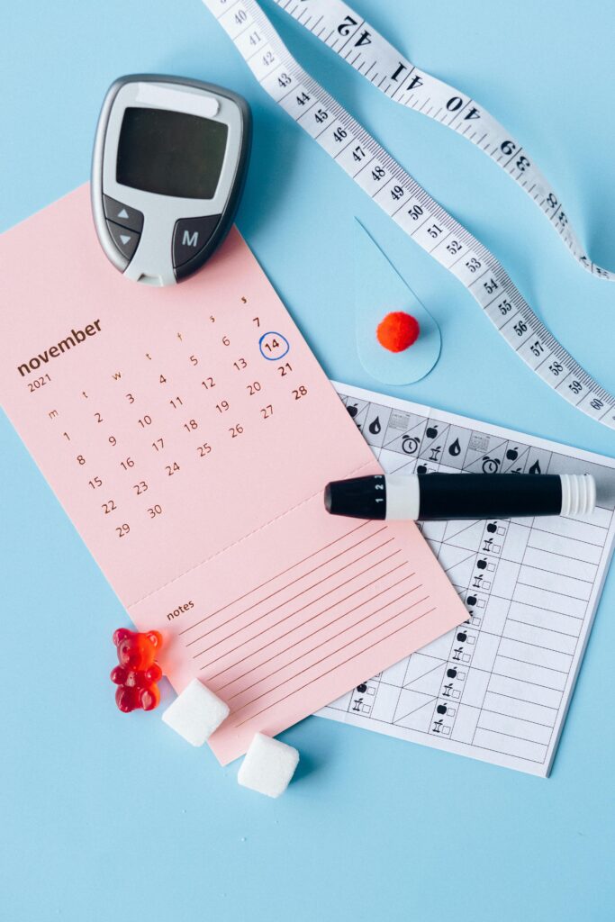 pexels-photo-6942039-6942039 Flat lay of diabetes awareness tools on a blue backdrop with calendar.